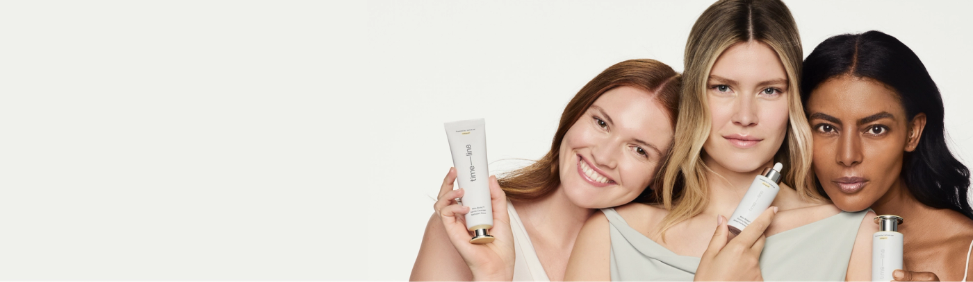 Three woman holding Mitopure skincare products